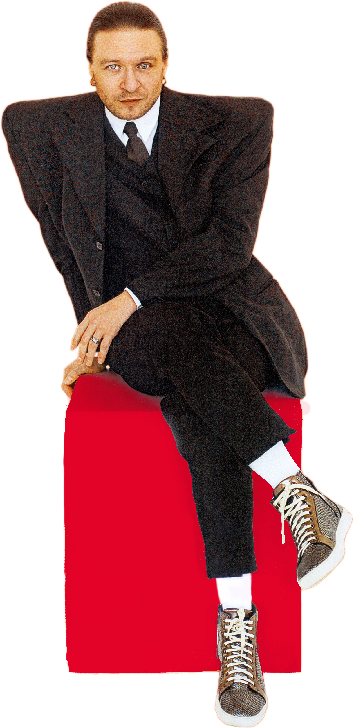 Stas Koroliov sitting on a red cube